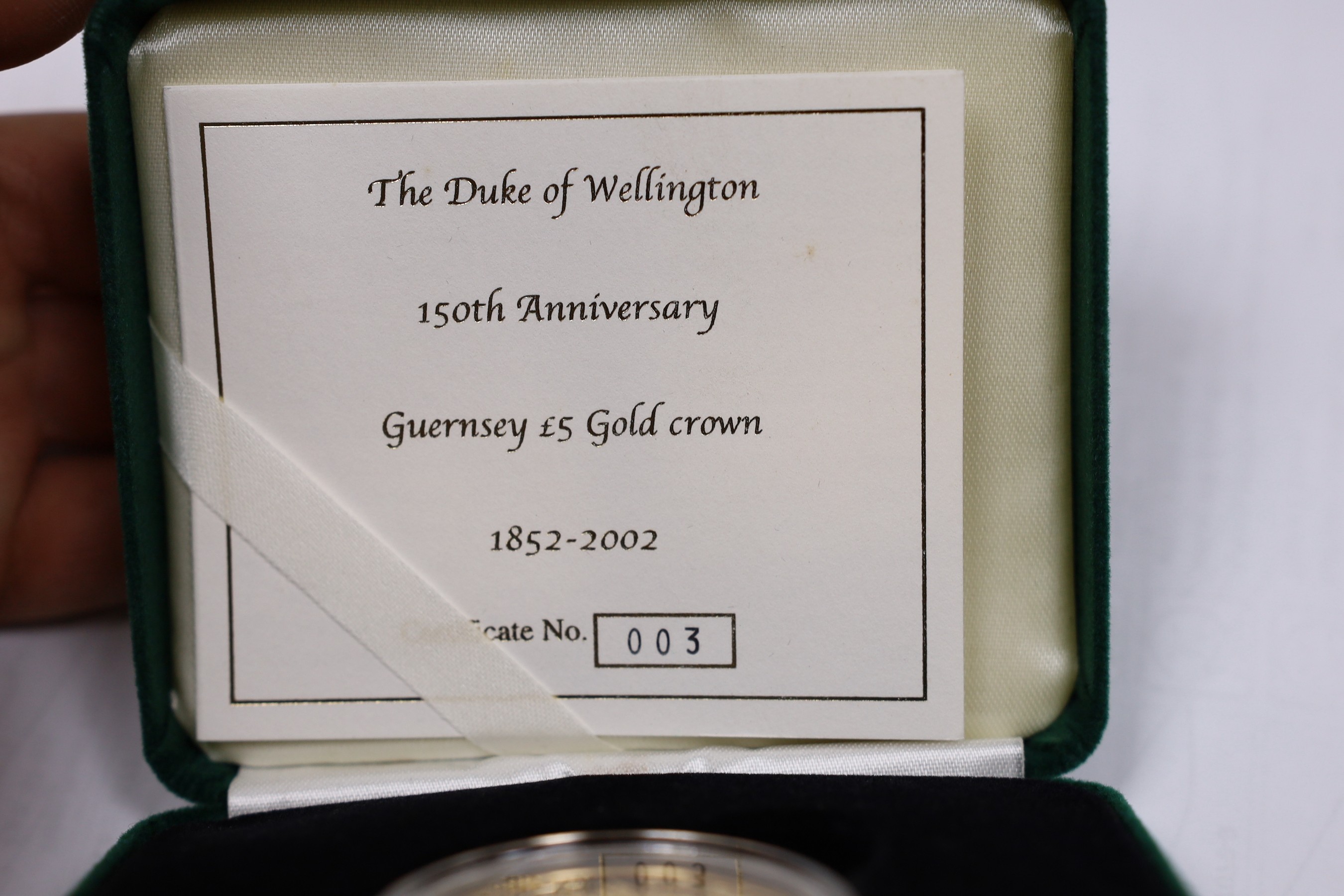 A cased limited edition 2002 'The Duke of Wellington 150th Anniversary Guernsey £5 gold crown 1852-2002', with certificate.